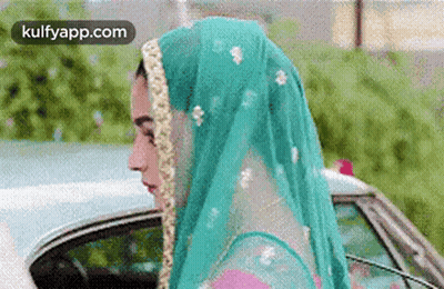 Woman In Veil Standing Next To Car GIF