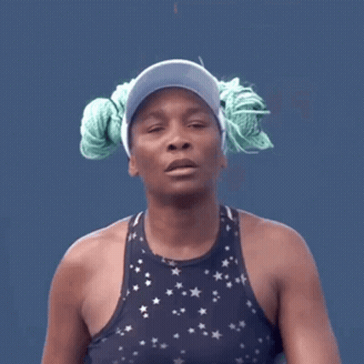 Woman In Visor And Star Tank Top With Rope In Hair GIF