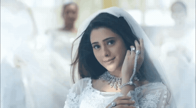 Woman In Wedding Dress And Veil Smiling GIF