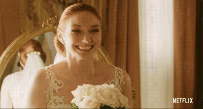 Woman In Wedding Dress Smiling Holding Bouquet Netflix Logo GIF
