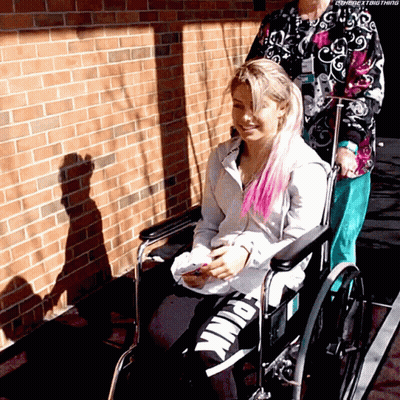 Woman In Wheelchair Pushed By Another Woman GIF