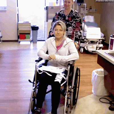 Woman In Wheelchair Pushed By Nurse Saying The Next Thing GIF