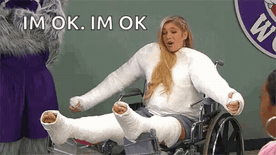 Woman In Wheelchair With Cast On Leg And Arm GIF