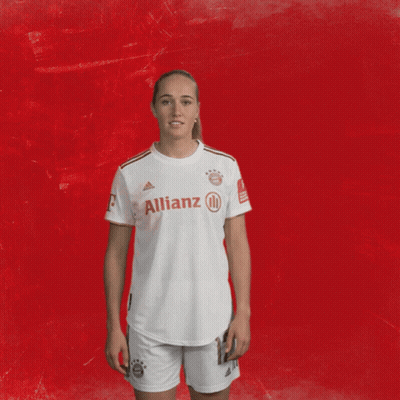 Woman In White Allianz Shirt At Red Wall GIF