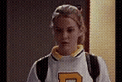 Woman In White And Yellow Jersey With Letter D GIF