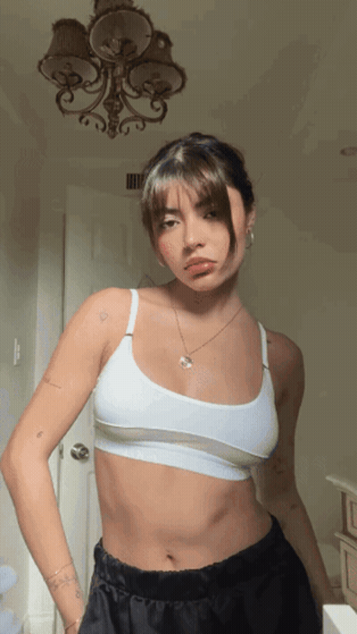 Woman In White Bra And Black Shorts GIF