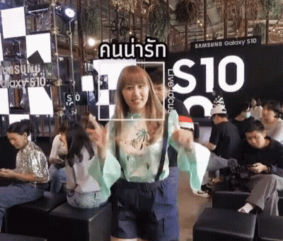 Woman In White Coat And Scarf In Car With Korean Writing GIF