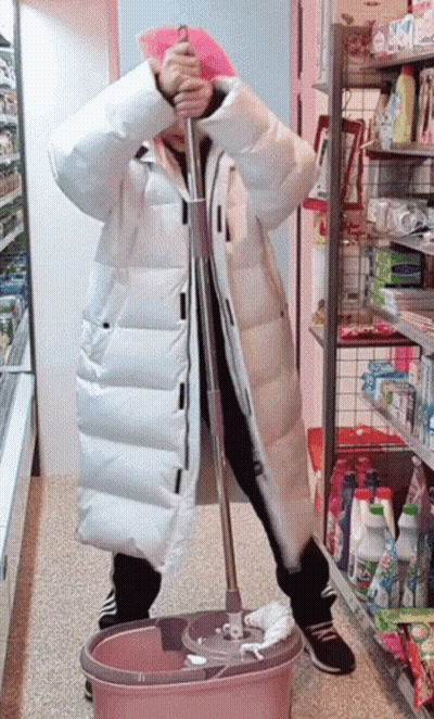 Woman In White Coat Holding Mop In Pink Bucket GIF