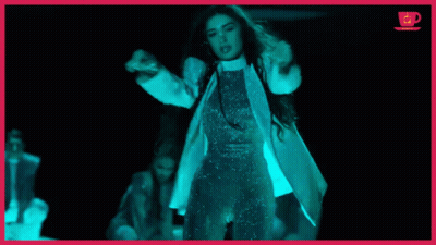 Woman In White Coat In Dark Room GIF