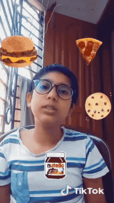 Woman In White Coat In Front Of Red Chair On NBC The Voice GIF
