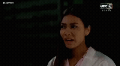 Woman In White Coat Making Funny Face GIF