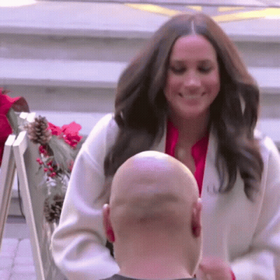 Woman In White Coat Next To Bald Man GIF