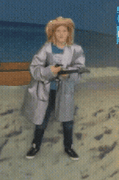 Woman In White Coat Walking On Beach GIF