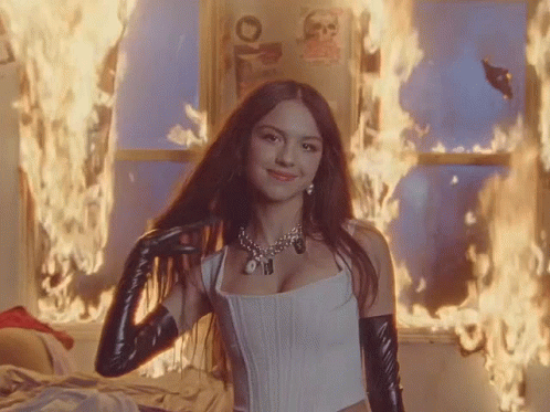 Woman In White Corset And Black Gloves GIF