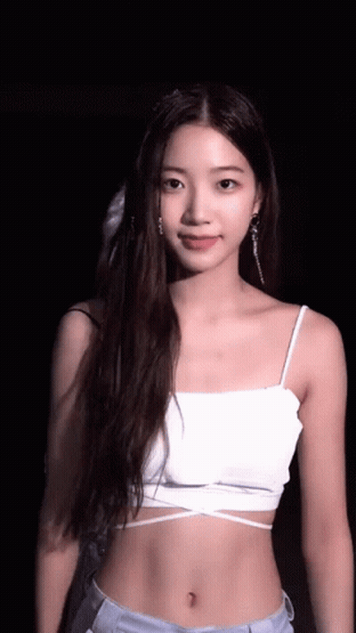 Woman In White Crop Top And Jeans GIF