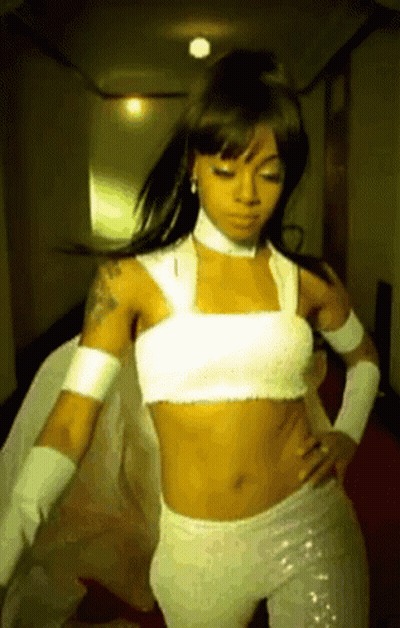 Woman In White Crop Top And White Pants Dancing GIF