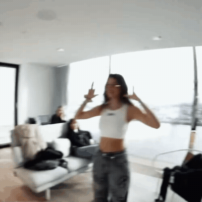 Woman In White Crop Top Dancing And Giving Middle Finger GIF