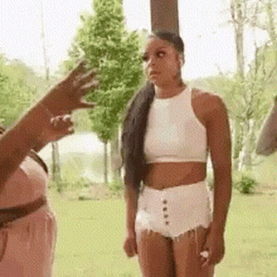 Woman In White Crop Top Next To Woman In Pink Dress GIF