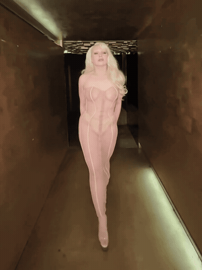Woman In White Crop Top Standing In Front Of Mirror GIF