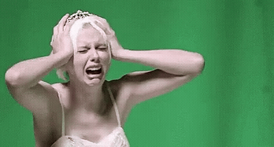 Woman In White Dress And Tiara Crying Holding Head GIF