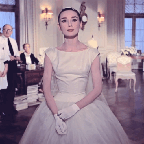 Woman In White Dress And White Gloves Standing In Room GIF
