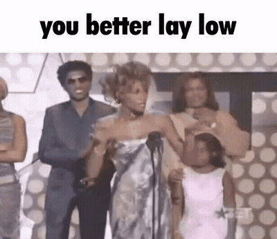 Woman In White Dress At Microphone GIF
