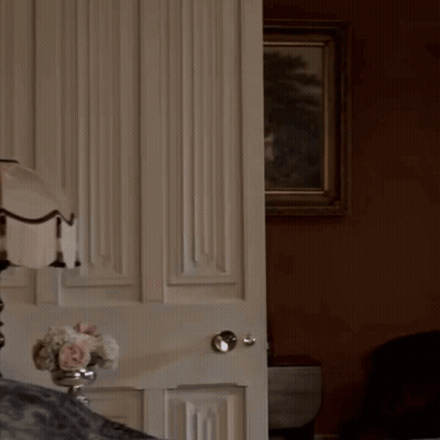 Woman in White Dress Behind Door