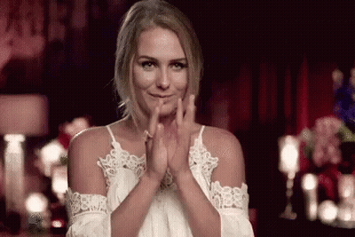 Woman In White Dress Clapping In Dark Room GIF