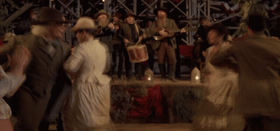 Woman In White Dress Dancing In Crowd GIF