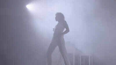 Woman In White Dress Dancing In Fog GIF