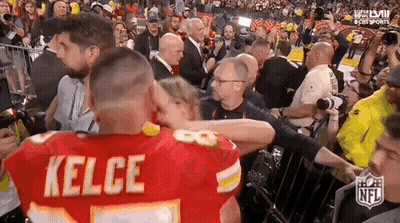 Woman In White Dress Dancing In Front Of Crowd GIF