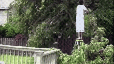 Woman In White Dress Dancing In Front Of Drum Set GIF