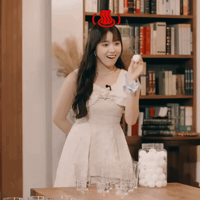 Woman In White Dress Holding Ball GIF