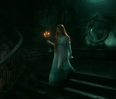 Woman In White Dress Holding Candle GIF