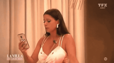 Woman In White Dress Holding Cell Phone GIF