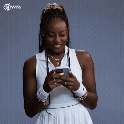 Woman In White Dress Holding Cell Phone GIF