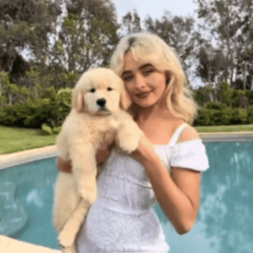 Woman In White Dress Holding Puppy GIF