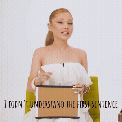 Woman In White Dress Holding Sign I Didn't Understand The First Sentence GIF