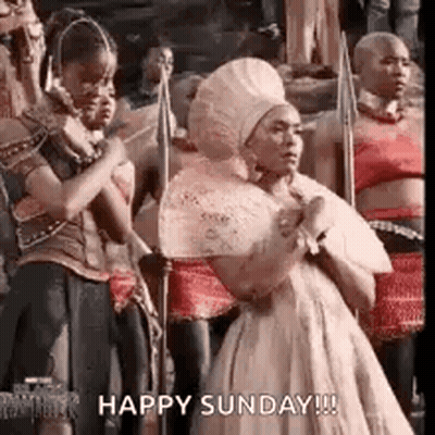 Woman In White Dress Holding Spears Saying Happy Sunday GIF