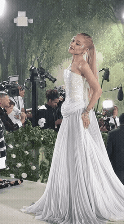 Woman In White Dress In Front Of Cameras GIF