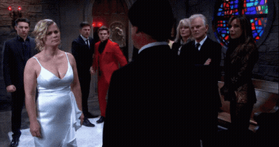 Woman In White Dress In Front Of Stained Glass Window GIF