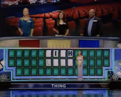 Woman In White Dress In Front Of Wheel Of Fortune Saying Thing GIF