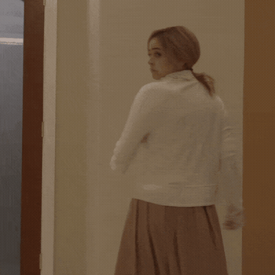 Woman In White Dress In Frosted Glass Doorway GIF