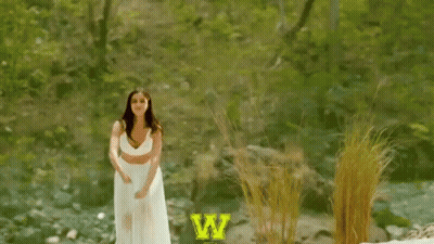 Woman In White Dress Jumping Saying Woohoo GIF