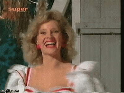 Woman In White Dress Laughing In Front Of Super Sign GIF