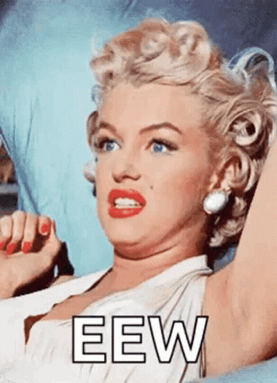 Woman In White Dress Laying On Bed Saying Eew GIF