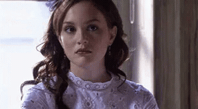 Woman In White Dress Looking At Camera GIF
