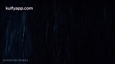 Woman In White Dress Lying In Rain GIF