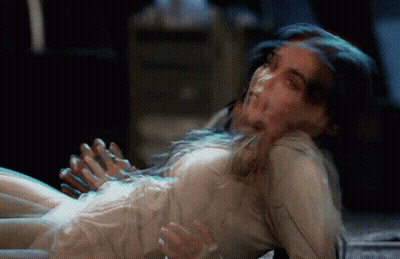Woman In White Dress Lying On Floor With Hands Outstretched GIF