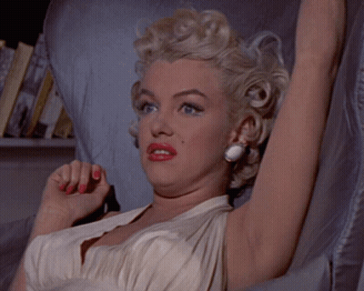 Woman In White Dress Making A Face GIF